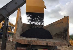 Discharging black mix on the truck